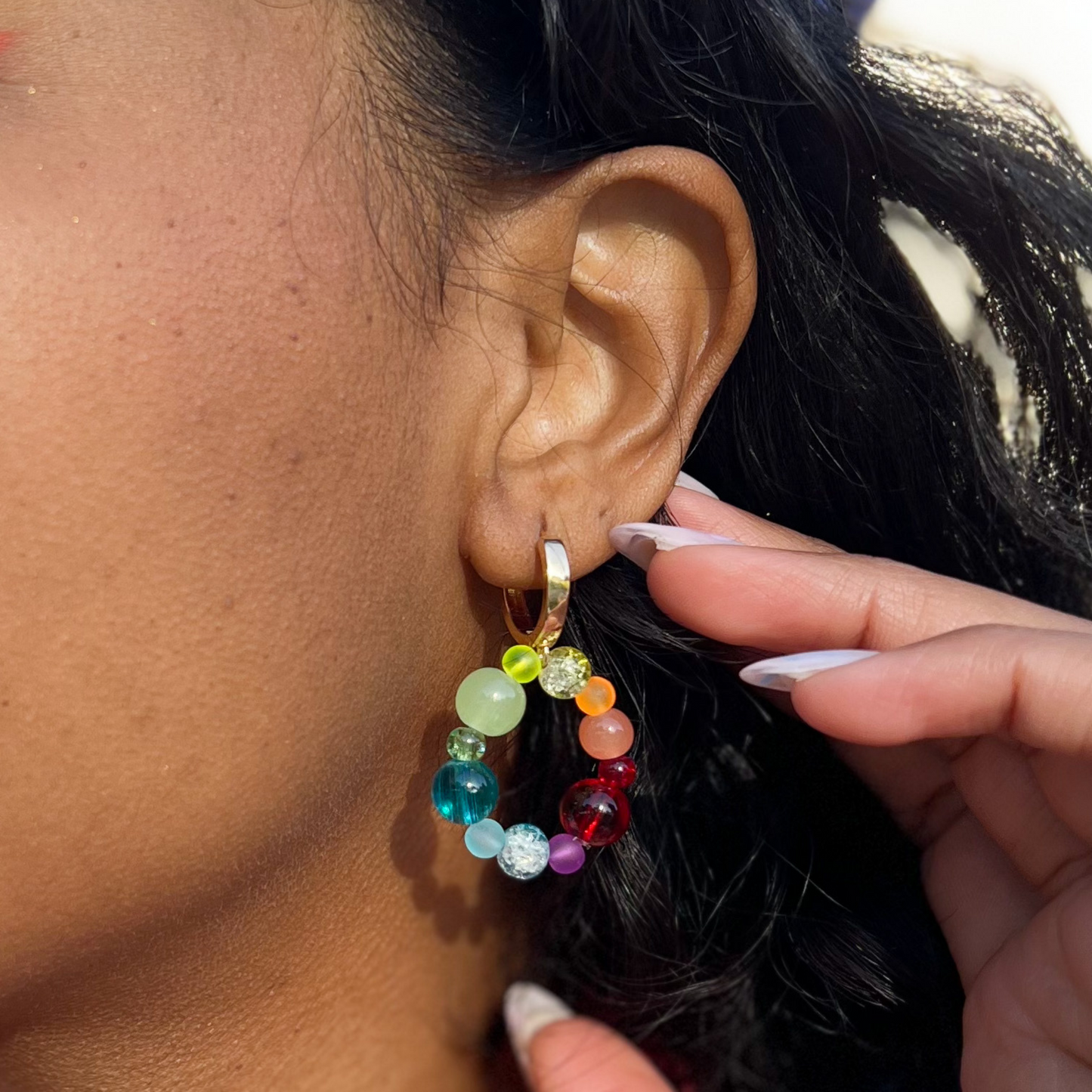 Roop Jewelry rainbow glass earrings. Kindergarten core aesthetic. Summer 2022 aesthetic. Spring 2022 aesthetic. Rainbow aesthetic. Summer 2022 jewelry trends. Jewelry styled on Danielle Meulens. 