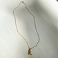 Roop Jewelry cowboy boot necklace. Sustainable and ethical jewelry in Oakland, ca.