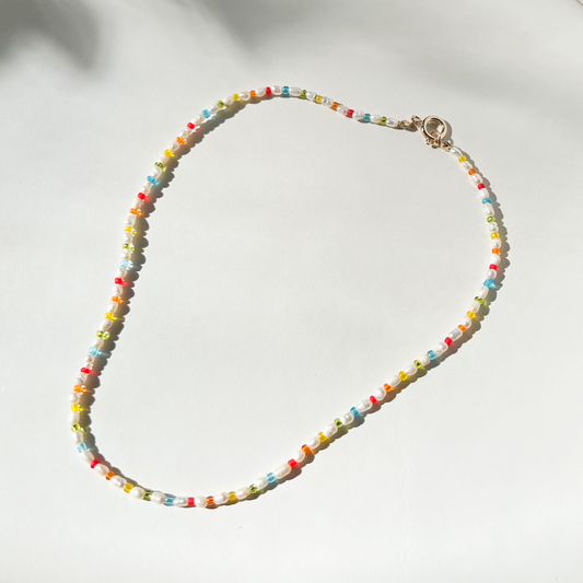 Roop Jewelry rainbow pearl necklace. Rainbow aesthetic jewelry. Spring 2022 aesthetic. Summer 2022 aesthetic. Pearl necklace in Oakland, Ca.