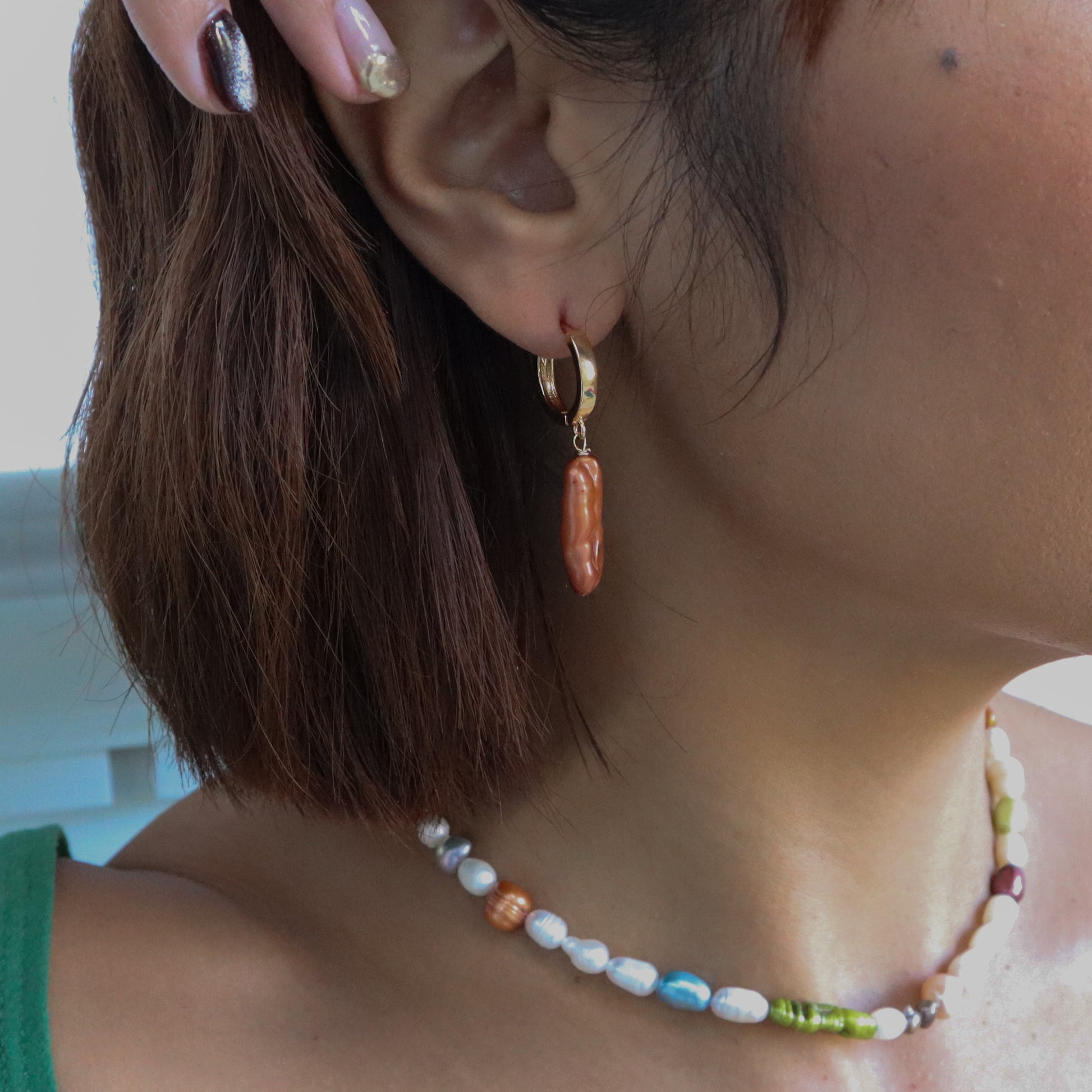 Roop Jewelry Biwa Pearl Earrings in Copper. Green pearl earrings. Shiny pearl earrings made in Oakland, Ca. 
