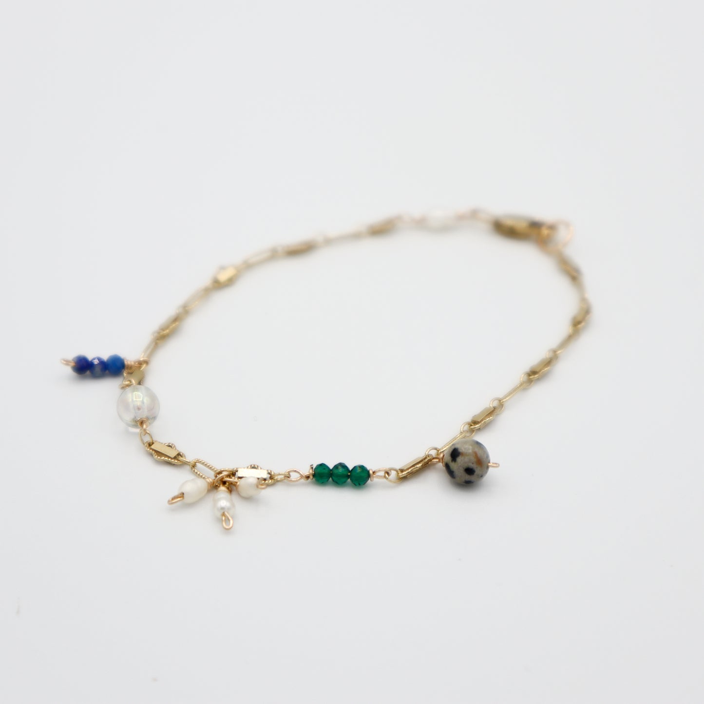 Roop Jewelry Sprinkle Bracelet. Lapis lazuli, emerald, dalmation stone, and pearl jewelry handmade in Oakland, Ca.