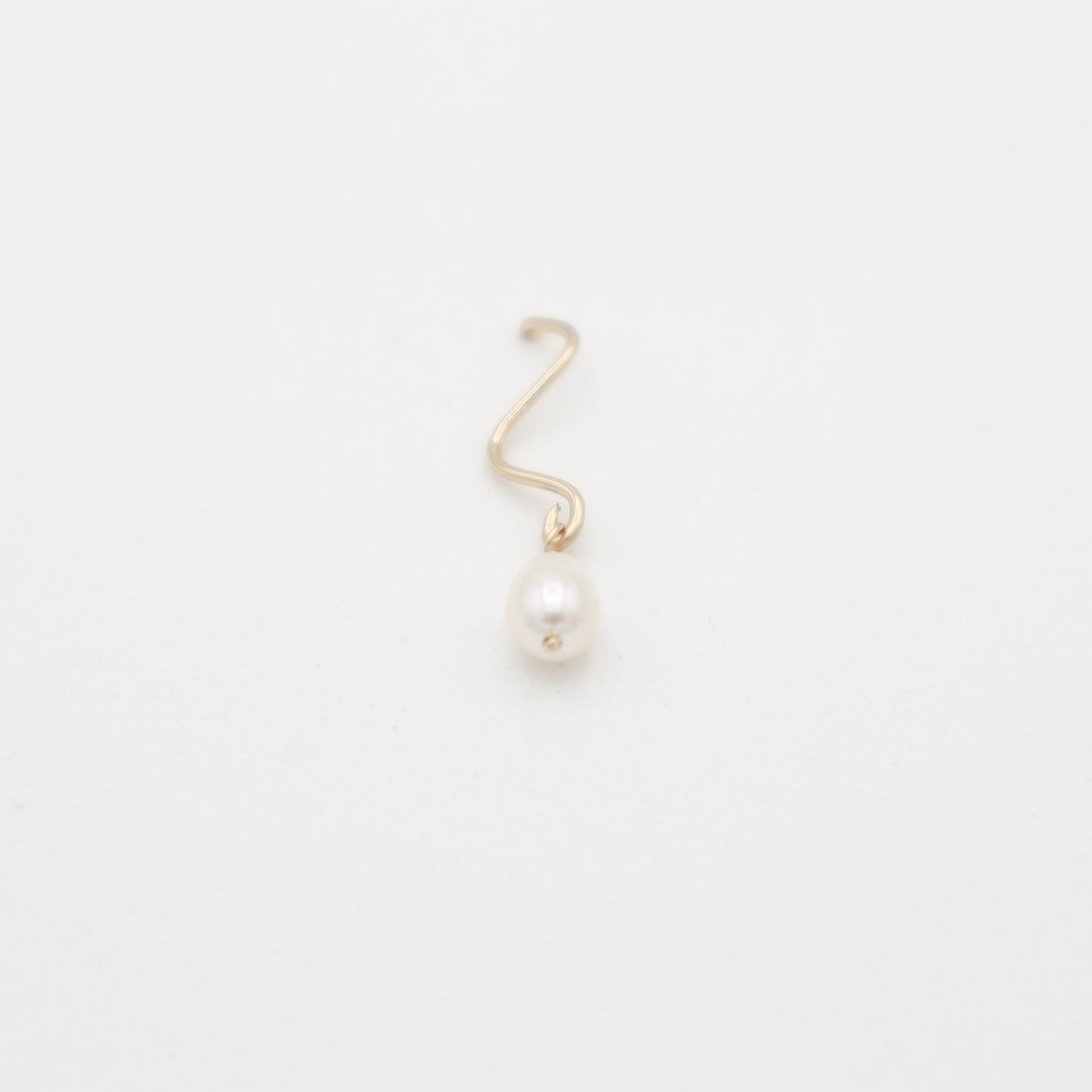 Roop Jewelry twinkle earrings in squiggly pearl. Handmade jewelry in Oakland, Ca.