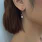Roop Jewelry twinkle earrings in squiggly pearl. Handmade jewelry in Oakland, Ca.