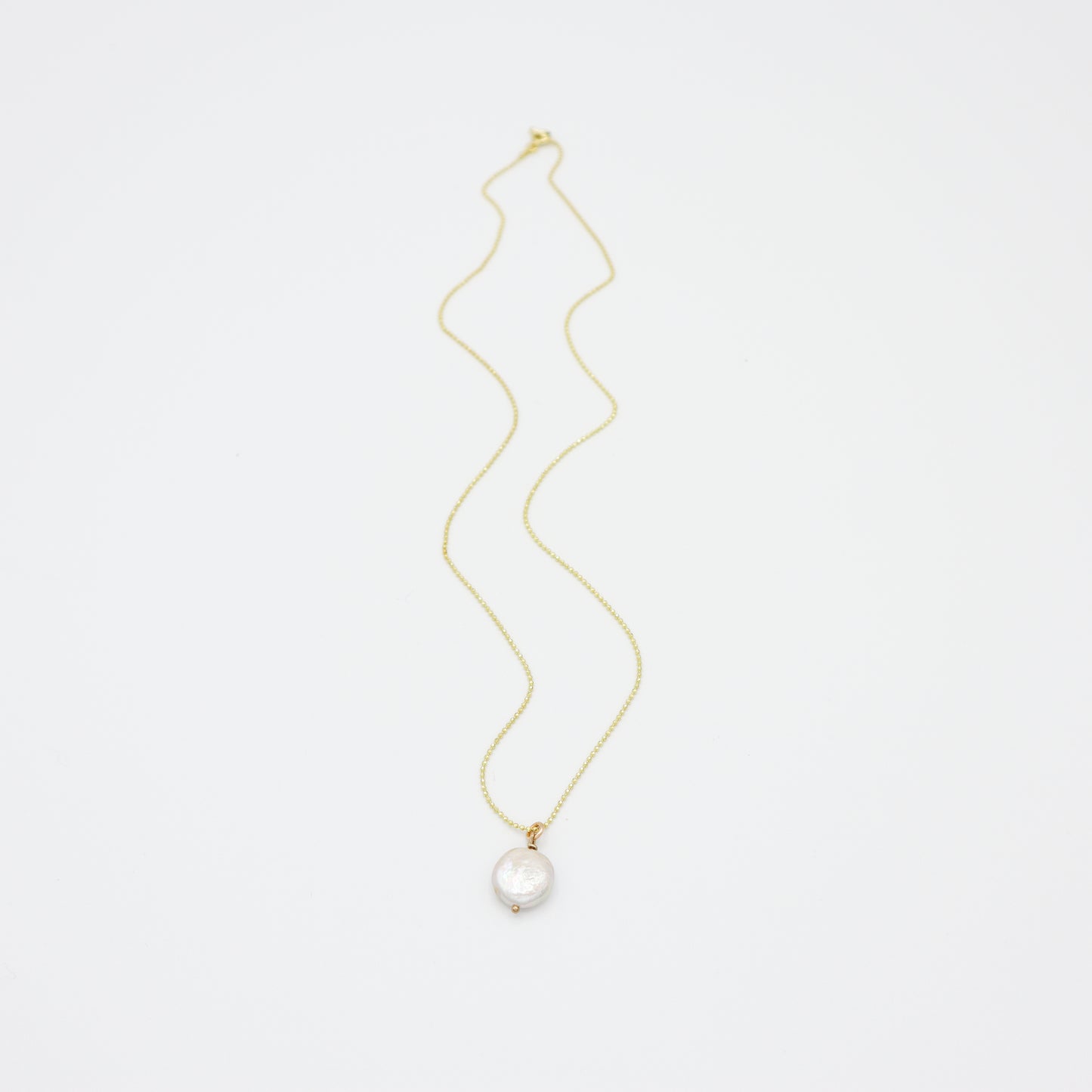 Roop Jewelry Sweet Pearl Necklace in Vermeil. Simple coin pearl necklace. Handmade pearl jewelry from Oakland, Ca.
