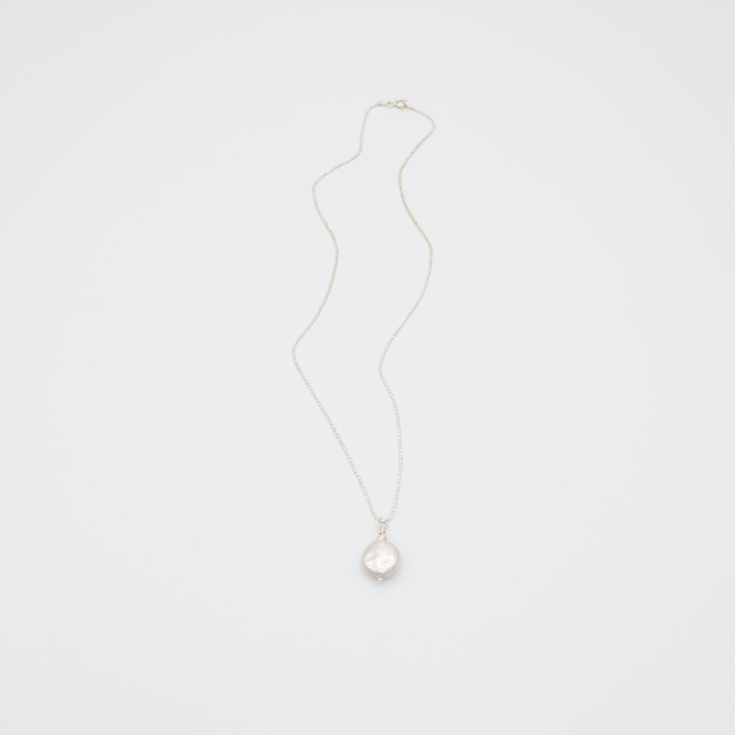 Roop Jewelry Sweet Pearl Necklace in Sterling Silver. Simple coin pearl necklace. Handmade pearl jewelry from Oakland, Ca.