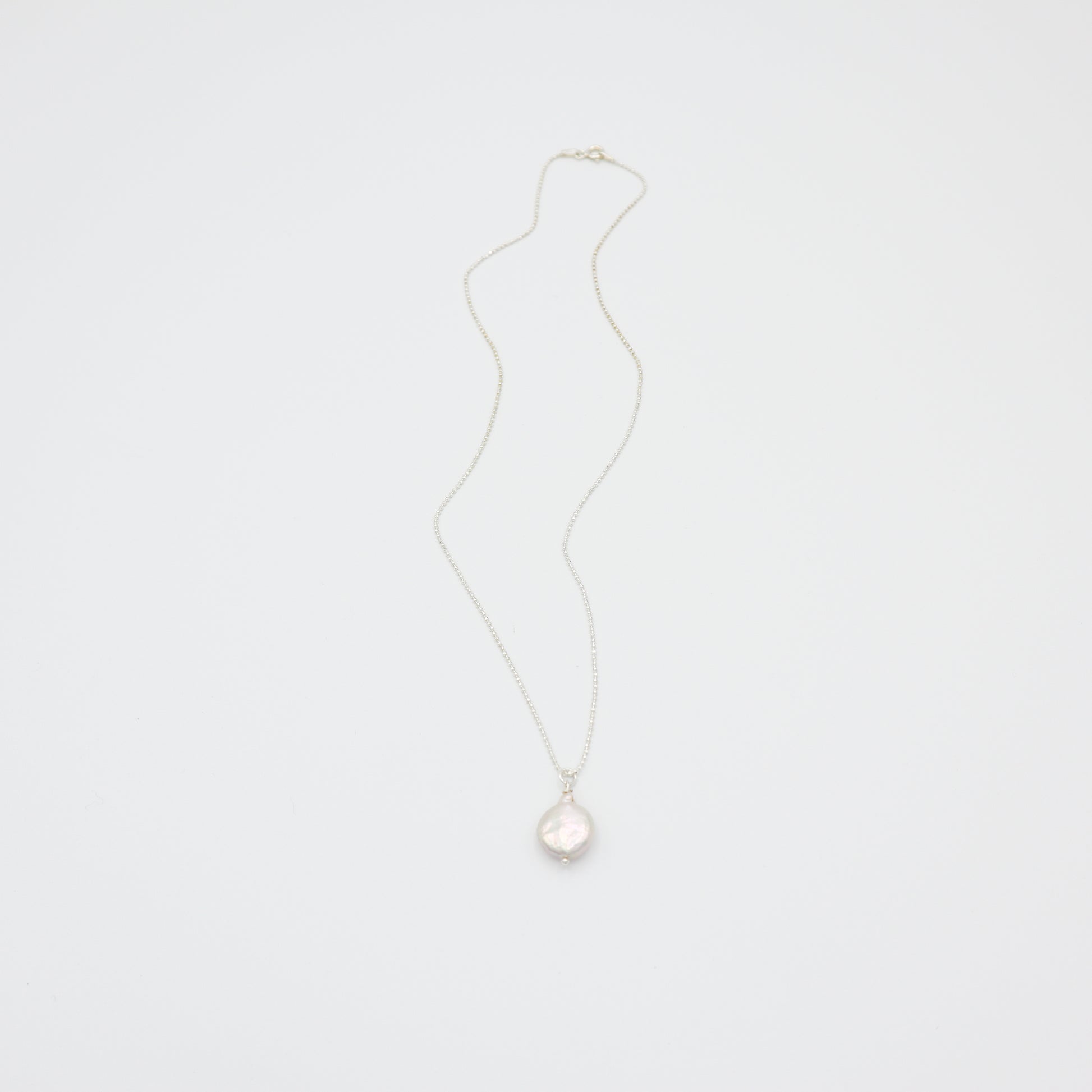 Roop Jewelry Sweet Pearl Necklace in Sterling Silver. Simple coin pearl necklace. Handmade pearl jewelry from Oakland, Ca.